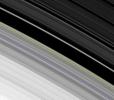 This image obtained by NASA's Cassini spacecraft of the outer edge of Saturn's B ring, reveals the combined effects of a tugging moon and oscillations that can naturally occur in disks like Saturn's rings and spiral galaxies. 