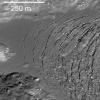 NASA's Lunar Reconnaissance Orbiter captures frozen impact melt flows on the floor of Moore F, a farside highlands crater.