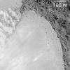 NASA's Lunar Reconnaissance Orbiter captures a debris flow extending down the southwest wall of Janssen K crater.