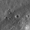 This image taken NASA's Lunar Reconnaissance Orbiter is a high-resolution view of part of the floor of Riccioli Crater. The view is centered on the boundary between a spur of the crater's central peak materials and volcanic lava flow deposits.