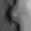 A sinuous rille created by a lava flow snakes around the base of a massif in the Prinz-Harbinger region on the Moon in this image taken by NASA's Lunar Reconnaissance Orbiter.