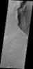This image captured by NASA's 2001 Mars Odyssey shows a landslide deposit located in an unnamed crater in Syrtis Planum.