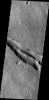 The fractures in this image from NASA's 2001 Mars Odyssey are located on the northwestern flank of the Elysium Mons volcanic complex.