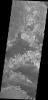 Parts of Meridiani Planum have a surface that appears to be composed of different layers of material. In this image taken by NASA's Mars Odyssey the contrast of bright and dark materials indicates the different layers.