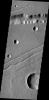 The channel-like features in this image captured by NASA's Mars Odyssey are fault bounded down-dropped blocks of material. These tectonic features are called Labaetis Fossae and are located on the eastern margin of the Tharsis Volcanic complex.