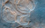 The western Utopia Planitia in the Northern mid-latitudes of Mars is marked by a peculiar type of depression with scalloped edges and by a network of polygonal fractures as seen by NASA's Mars Reconnaissance Orbiter.