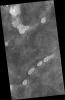 This image from NASA's Mars Reconnaissance Orbiter is a proposed future Mars landing site in Acidalia Planitia targets densely occurring mounds thought to be mud volcanoes.