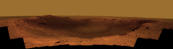 NASA's Mars Exploration Rover Opportunity is spending the seventh anniversary of its landing on Mars investigating a crater called 'Santa Maria,' which has a diameter about the length of a football field. This scene looks eastward across the crater.
