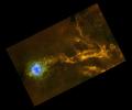 Dense filaments of gas in the IC5146 interstellar cloud can be seen clearly in this image taken in infrared light by the Herschel space observatory. The blue region is a stellar nursery known as the Cocoon nebula.