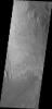 Wind has eroded the deposit on the floor of Gale Crater in this image captured by NASA's 2001 Mars Odyssey.