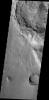 The pristine nature of this crater and its ejecta indicate that it is younger than the outflow channel where it is located. This image is from NASA's 2001 Mars Odyssey.