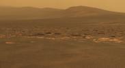 A portion of the west rim of Endeavour crater sweeps southward in this color view from NASA's Mars Exploration Rover Opportunity. The rover's first destination on the rim, called 'Spirit Point' in tribute to Opportunity's now-inactive twin, Spirit.