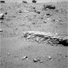 The flat-topped rock, informally named 'Tisdale 2,' just below the center of this raw image from the rover Opportunity's panoramic camera was chosen by the rover team in August 2011 as a stop for inspecting with tools on Opportunity's robotic arm.