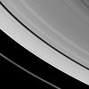 Saturn's tiny moon Pan orbits in the middle of the Encke Gap of the planet's A ring in this image from NASA's Cassini spacecraft. Pan is visible as a bright dot in the gap near the center of this view.