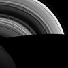 NASA's Cassini spacecraft shows Saturn's shadow cutting sharply across its rings as the orbits of ring particles carry them suddenly from day to night. With no atmosphere to scatter light, shadows in space are much darker than we're used to here on Earth.