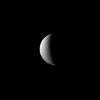 In this recent view of Dione, NASA's Cassini spacecraft looks on as the moon's slow rotation brings the terrain from day into night. Dione's rotation period is 66 hours.