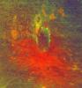 This false-color image obtained by NASA's Dawn spacecraft shows a crater on the giant asteroid Vesta. The reddish coloring below the crater points to material that was hurled from Vesta's interior during an impact or originated from the impactor itself.