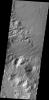 Multiple channels dissect the rim of Bakhuysen Crater in Noachis Terra in this image captured by NASA's 2001 Mars Odyssey spacecraft.