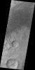 A large sandsheet with surface dune forms is shown in this image of Aonia Terra captured by NASA's 2001 Mars Odyssey spacecraft.