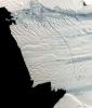 This image from NASA's Terra spacecraft shows a massive crack across the Pine Island Glacier, a major ice stream that drains the West Antarctic Ice Sheet. Eventually, the crack will extend all the way across the glacier.