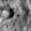This image of a dark-rayed impact crater and several dark spots was obtained by NASA's Dawn spacecraft. The dark materials are located near an older, larger crater in the Sextilia quadrangle of asteroid Vesta's southern hemisphere.
