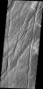 This image from NASA's Mars Odyssey spacecraft shows a portion of Tempe Fossae, a region of parallel to subparallel paired fractures called graben.