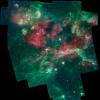 A bubbling cauldron of star birth is highlighted in this image from NASA's Spitzer Space Telescope. Massive stars have blown bubbles, or cavities, in the dust and gas -- a violent process that triggers both the death and birth of stars.