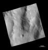 This image from NASA's Dawn spacecraft shows a rough surface covered with ejecta and fine grooves on the giant asteroid Vesta.