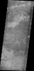 The volcanic flow in this image from NASA's 2001 Mars Odyssey spacecraft appears to have flowed in one layer. The surface texture is blocks of lava which cooled and still moved on molten lava below, producing the plate-like texture.