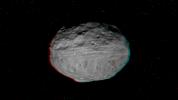 This anaglyph shows the topography of Vesta's eastern hemisphere; equatorial troughs are visible around asteroid Vesta's equator and north of these troughs there are a number of highly degraded, old, large craters. You need 3-D glasses to view this image.