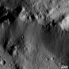 This image from NASA's Dawn spacecraft shows many highly degraded craters in the top part of the image. These craters are so degraded that their rims are only partially visible.