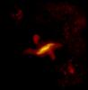 This parallelogram shaped region of dust observed by ESA's Herschel Space telescope can be best described using galaxy formation models where a flat spiral galaxy collides with an elliptical galaxy becoming warped in the process.