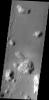 Most of the hills in this image from NASA's 2001 Mars Odyssey spacecraft have dark streaks thought to be where bright dust has been removed by sliding down the hillside.