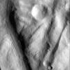 This image, from NASA's Dawn spacecraft, shows rock material that has moved across the surface and flowed into a low area in the ridged floor of the Rheasilvia basin on asteroid Vesta.