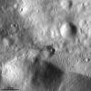 This image from NASA's Dawn spacecraft, located in asteroid Vesta's Urbinia quadrangle in the Vestan southern hemisphere, shows a small crater with ejecta made of dark material.