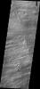 This image captured by NASA's 2001 Mars Odyssey spacecraft shows volcanic flows from Arsia Mons, the southernmost of the Tharsis volcanoes.