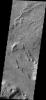This complexly eroded region is part of Aeolis Planum with portions that appear to be layered material that has been eroded by wind action. This image is from NASA's 2001 Mars Odyssey spacecraft.