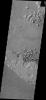 This small region of hills appears to be forming from the fractured material just south of it. This material is the northern extension of Zephyria Planum. This image is from NASA's 2001 Mars Odyssey spacecraft.