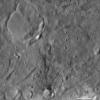 This image from NASA's Dawn spacecraft of asteroid Vesta shows Urbinia and Sossia craters, located in Vesta's Urbinia quadrangle. Urbinia is the large crater, and Sossia is the small crater surrounded by dark material in the bottom of the image.