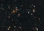 Astronomers using NASA's Hubble Space Telescope have found a puzzling arc of light behind an extremely massive cluster of galaxies residing 10 billion light-years away.