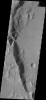 This image from NASA's 2001 Mars Odyssey spacecraft shows a landslide occurred on the rim of Fesenkov Crater on Mars, creating the deposit visible in this image.