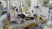 This frame from a video shows the mast of NASA's Curiosity rover deploying in a pre-launch test.