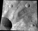 This image from NASA's Dawn spacecraft shows a close up of part of the rim around the crater Canuleia on the giant asteroid Vesta. Canuleia, about 6 miles (10 kilometers) in diameter, is the large crater at the bottom-left of this image.