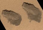 This is a view of the third (left) and fourth (right) trenches made by the 1.6-inch-wide (4-centimeter-wide) scoop on NASA's Mars rover Curiosity in October 2012 and shows some of the details regarding the properties of the 'Rocknest' wind drift sand.