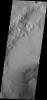 A small field of dunes on Mars is visible in this image from NASA's 2001 Mars Odyssey spacecraft of an unnamed crater in Arabia Terra.