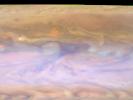 The dark hot spot in this false-color image from NASA's Cassini spacecraft is a window deep into Jupiter's atmosphere. All around it are layers of higher clouds, with colors indicating which layer of the atmosphere the clouds are in.