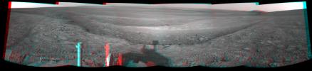 This 3-D view from the navigation camera on NASA's Mars Exploration Rover Opportunity shows a vista across Endeavour Crater, with the rover's own shadow in the foreground.