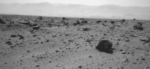 The prominent rock in this image from NASA's rover Curiosity, informally named 'East Bull Rock,' is about 20 inches (half a meter) high. The rock-studded local rise dominating the image is called 'Elsie Mountain'.