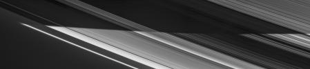 Saturn's shadow sweeps across the rings in a view captured on Nov. 5, 2006 by NASA's Cassini spacecraft. Countless icy particles that make up the rings bask in full daylight.