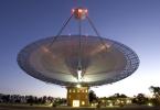 This image shows the Parkes telescope in Australia, part of the Commonwealth Scientific and Industrial Research Organization. Researchers used the telescope to detect the first population of radio bursts known to originate from beyond our galaxy.